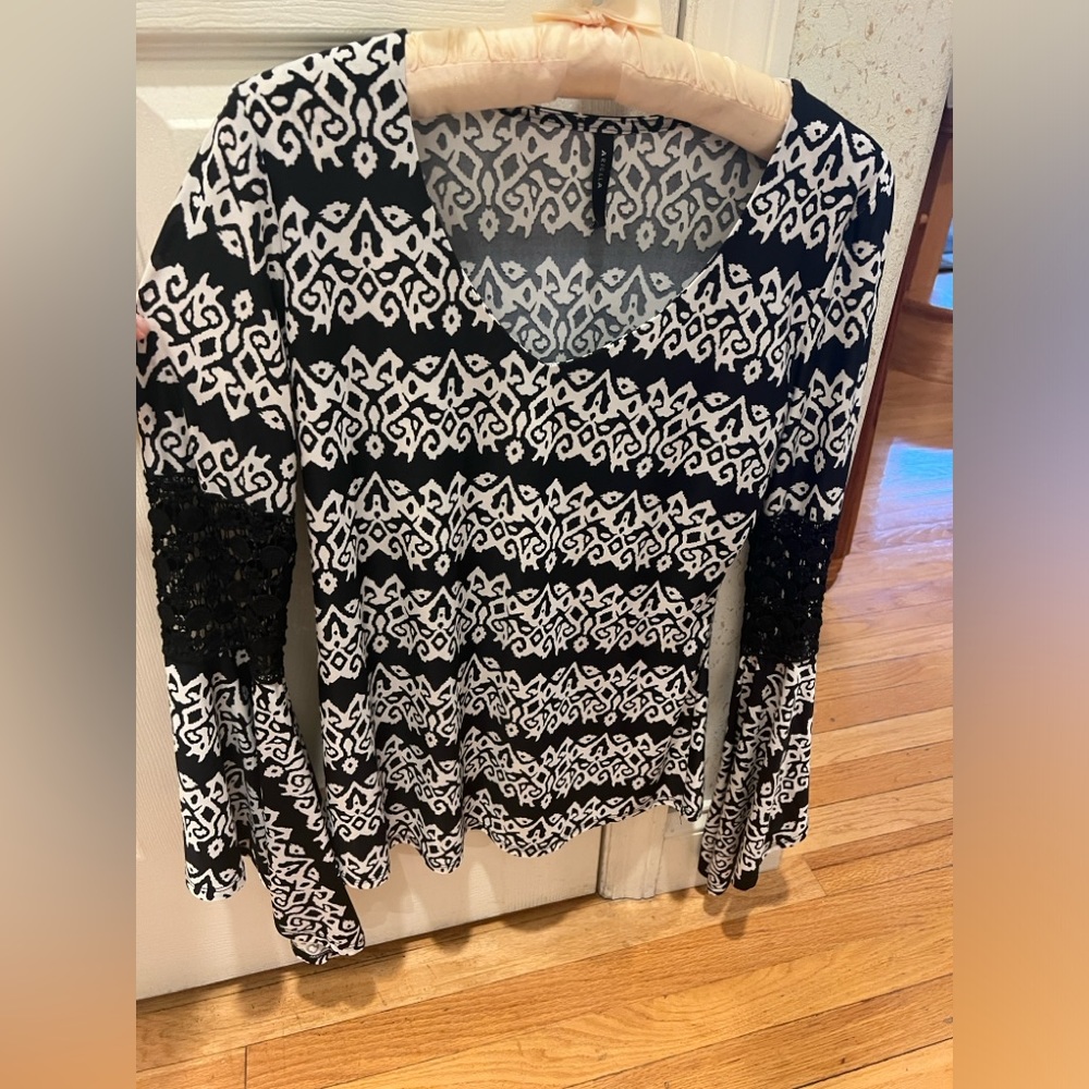black and white top with lace and flared arms